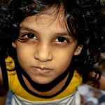 boy in white and yellow crew neck shirt
